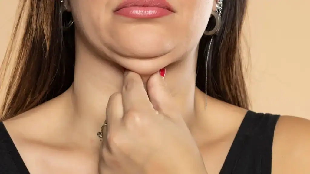 An image of a woman with double chin, sad, worried : Non Surgical Double Chin Removal Treatment in Nottinghamshire, UK